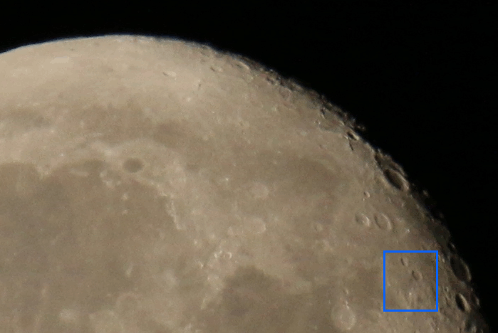 animation of five frames as Tiangong transits the nearly-full moon, marked