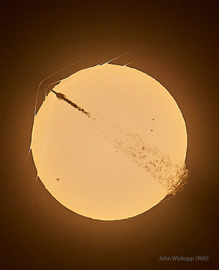 SpaceX Falcon 9 passing in front of sun at launch, from Astronomy Picture of the Day, image credit John Winkopp, WAI Media