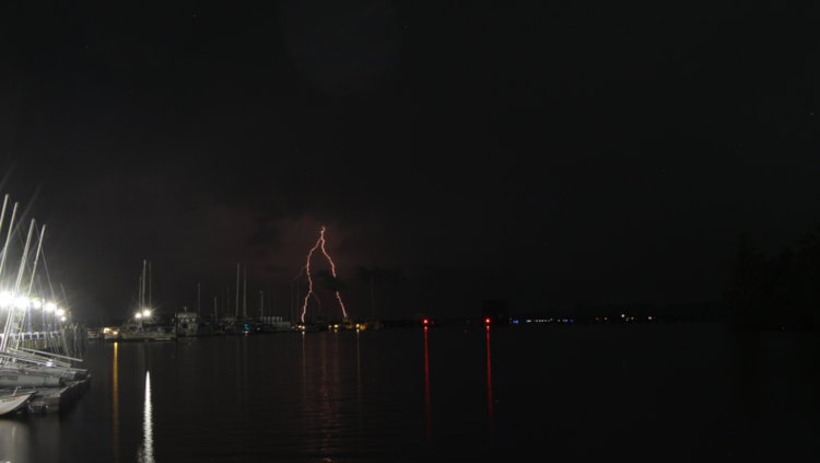 distant lightning bolt over Pamlico River at night