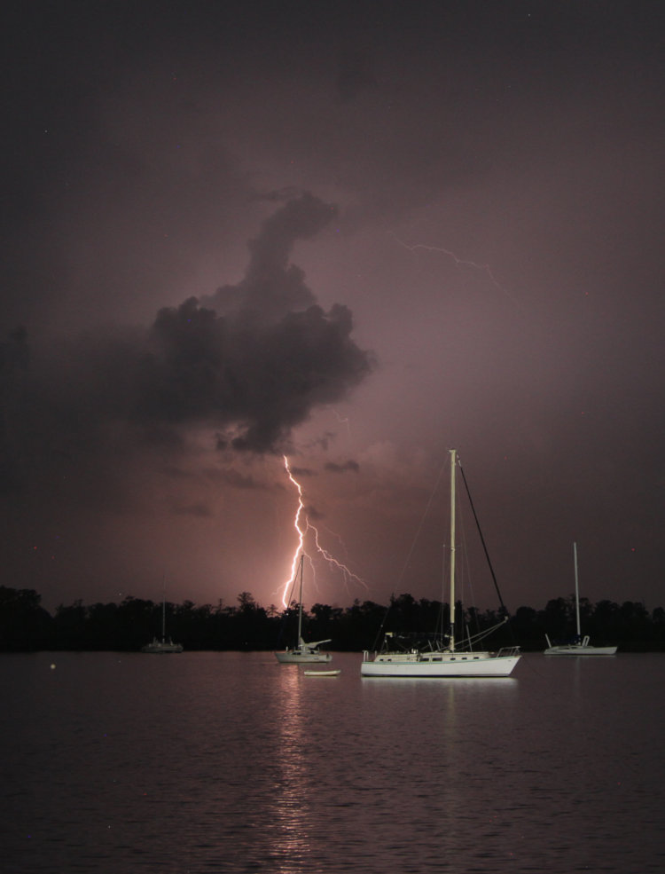 visible lightning strike at night over Pamlico River