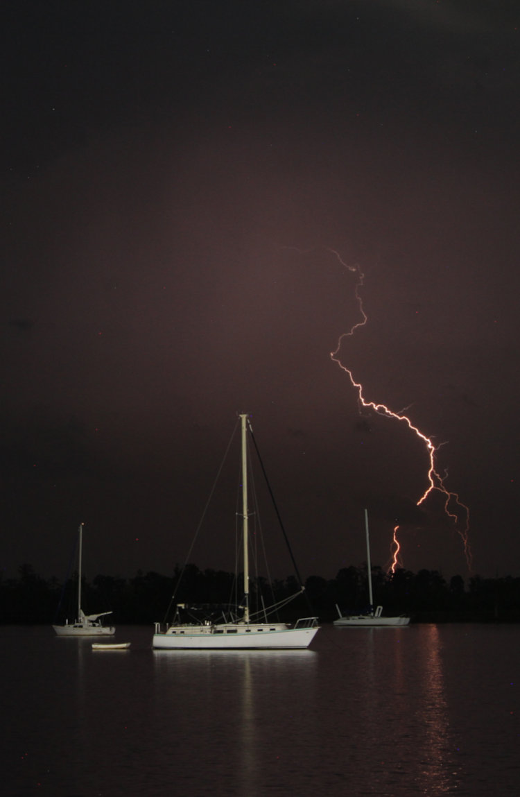 lightning strike over sailboats at night, Pamlico River