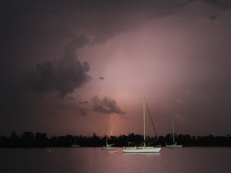 semi-obscured lightning strike over Pamlico River