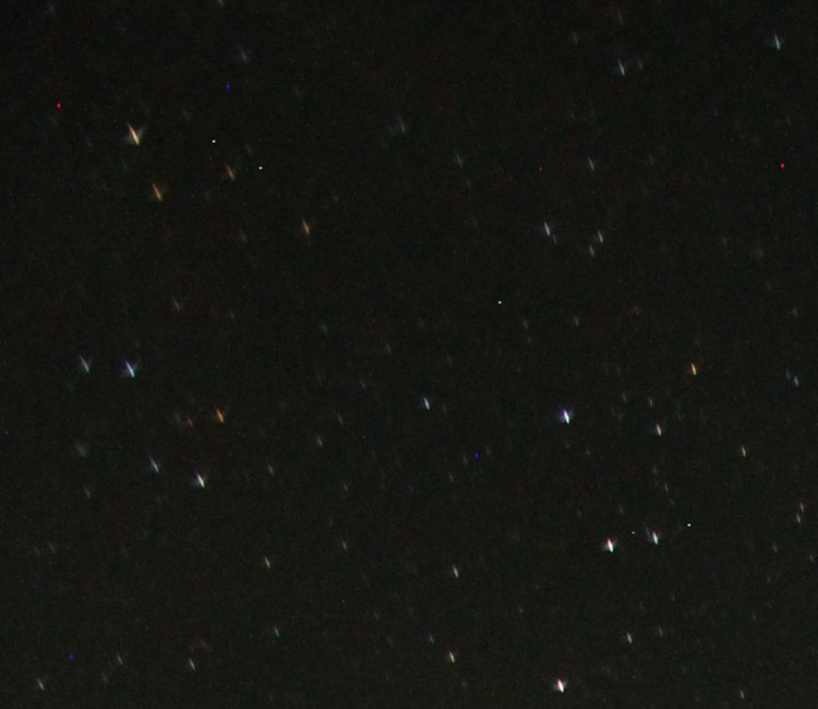 inset of previous frame showing anastigmatic distortion of stars at edges of frame during night exposure.