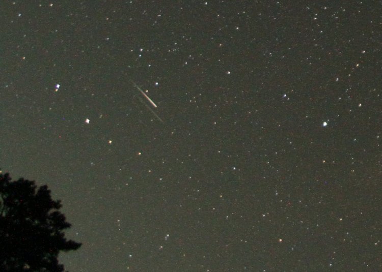 parallel tracks of two moving bright objects during long night exposure, not likely meteors