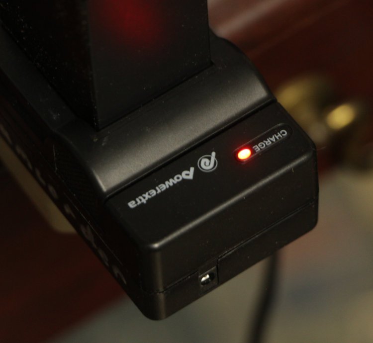 camcorder battery charger showing red light or proper charging condition after repair